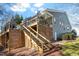 Multi-level deck with stairs and a covered section, providing ample outdoor living and entertaining space at 201 Sea Biscuit Lane, Apex, NC 27539