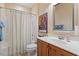 Bright bathroom featuring a shower-tub combo with a modern vanity at 201 Sea Biscuit Lane, Apex, NC 27539