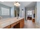 Spacious bathroom with a double sink vanity and large mirror, opens to the main bedroom at 201 Sea Biscuit Lane, Apex, NC 27539