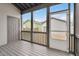 Covered back porch with a screen door, gray flooring, and neutral paint at 2098 Great Ridge Pkwy, Chapel Hill, NC 27516