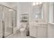 Modern bathroom features a glass shower and a white vanity at 2098 Great Ridge Pkwy, Chapel Hill, NC 27516