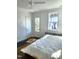 Bright bedroom features hardwood floors, white walls, and plenty of natural light at 2098 Great Ridge Pkwy, Chapel Hill, NC 27516