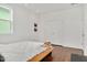 Bright bedroom features hardwood floors, white walls, and plenty of natural light at 2098 Great Ridge Pkwy, Chapel Hill, NC 27516