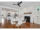 Bright and open floor plan of dining room leading into kitchen with a fireplace at 2098 Great Ridge Pkwy, Chapel Hill, NC 27516