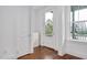 Clean and bright entryway with a white door, hardwood floors, and ample natural light at 2098 Great Ridge Pkwy, Chapel Hill, NC 27516