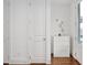 Bright hallway featuring hardwood floors, a large closet, and modern accents at 2098 Great Ridge Pkwy, Chapel Hill, NC 27516