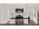 Modern kitchen features stainless steel appliances, white cabinetry, and subway tile backsplash at 2098 Great Ridge Pkwy, Chapel Hill, NC 27516