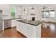 Bright, modern kitchen with white cabinetry, stainless steel appliances, and a large center island at 2098 Great Ridge Pkwy, Chapel Hill, NC 27516