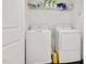 Laundry room featuring a washer, dryer and ample shelving for storage at 2098 Great Ridge Pkwy, Chapel Hill, NC 27516