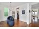 Cozy living room with hardwood floors, a built-in bookcase, and stylish seating at 2098 Great Ridge Pkwy, Chapel Hill, NC 27516