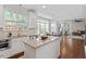 Spacious open kitchen featuring a granite island, stainless steel appliances, and hardwood floors at 211 Candia Ln, Cary, NC 27519