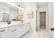 Bathroom featuring double sinks, modern fixtures, and a marble-style tiled floor at 219 E American Merigold Dr # 45, Benson, NC 27504