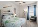 Nicely decorated bedroom with a uniquely styled bed, aviation-themed decor, and lots of natural light at 219 E American Merigold Dr # 45, Benson, NC 27504