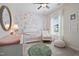 Charming Bedroom featuring a crib, rocking chair, floral wallpaper, and soft, natural light at 219 E American Merigold Dr # 45, Benson, NC 27504
