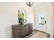 Inviting foyer featuring a stylish console table, mirror, and decorative lighting, leading into the home at 219 E American Merigold Dr # 45, Benson, NC 27504