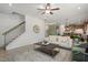 Open-concept living room with a cozy sofa, stylish coffee table, and hardwood floors at 219 E American Merigold Dr # 45, Benson, NC 27504