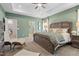 Serene main bedroom with a tray ceiling, cozy bedding, and neutral decor at 219 E American Merigold Dr # 45, Benson, NC 27504