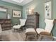 Comfortable main bedroom sitting area featuring elegant chairs, dresser and a soothing color palette at 219 E American Merigold Dr # 45, Benson, NC 27504