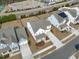 Aerial shot showcasing a home with a spacious yard, complemented by the surrounding community and nearby amenities at 2534 Great Daisy Ln, New Hill, NC 27562