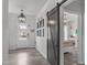 Charming foyer with barn door, stylish lighting, and easy access to a sunny bedroom at 2534 Great Daisy Ln, New Hill, NC 27562