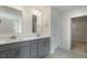 Modern bathroom featuring double sink vanity with gray cabinets and sleek fixtures at 257 Umstead St, Sanford, NC 27330