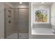 Elegant bathroom showcasing a glass-enclosed shower, a soaking tub by a window, and tile accents at 257 Umstead St, Sanford, NC 27330