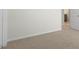 Neutral carpeted room with two doors, an electrical socket and access to a bathroom at 257 Umstead St, Sanford, NC 27330