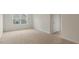 Neutral bedroom with carpet, a window, and a white door at 257 Umstead St, Sanford, NC 27330