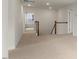 Carpeted hallway with wooden railing and banister at 257 Umstead St, Sanford, NC 27330