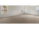 Spacious main bedroom with two windows and plush carpeting at 257 Umstead St, Sanford, NC 27330