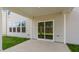 Back patio with sliding glass door and large windows, perfect for relaxing or entertaining at 257 Umstead St, Sanford, NC 27330