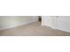 Comfortable bedroom with neutral carpet, white trim, and closet doors visible in the frame at 273 Umstead St, Sanford, NC 27330