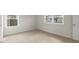 Cozy bedroom with natural light, carpeted floors, and a closet, perfect for relaxation and rest at 273 Umstead St, Sanford, NC 27330