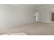 Spacious bedroom with neutral carpet and stairs view through door at 273 Umstead St, Sanford, NC 27330