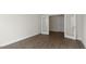 Bright flex room featuring dark wood-look floors and double French doors leading to another room at 273 Umstead St, Sanford, NC 27330