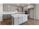 Well-appointed kitchen featuring modern gray cabinetry, center island, and stainless steel appliances at 273 Umstead St, Sanford, NC 27330