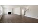 Spacious living room with modern flooring and a cozy fireplace, perfect for relaxing and entertaining at 273 Umstead St, Sanford, NC 27330