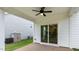 Cozy covered patio featuring a ceiling fan, sliding glass door, providing an inviting outdoor living space at 277 Umstead St, Sanford, NC 27330