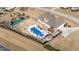 Overhead view showcasing the home's backyard oasis with a pool, play area, patio space, and privacy fence at 29 Alban Row, Fuquay Varina, NC 27526