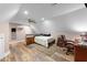 Spacious bedroom featuring hardwood floors, neutral paint, ceiling fan, and furniture at 29 Alban Row, Fuquay Varina, NC 27526