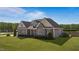 Attractive two-story home featuring a well-manicured lawn and inviting front porch at 29 Alban Row, Fuquay Varina, NC 27526