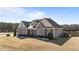 Spacious two-story home with neutral siding, a gabled roof, and a well-manicured front lawn at 29 Alban Row, Fuquay Varina, NC 27526
