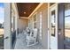 Charming front porch features rocking chairs and a stained wood ceiling at 29 Alban Row, Fuquay Varina, NC 27526