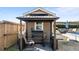 Outdoor grilling area and gazebo with comfortable seating and outdoor furniture at 29 Alban Row, Fuquay Varina, NC 27526