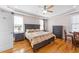 Spacious main bedroom features hardwood floors, a ceiling fan and recessed lighting at 29 Alban Row, Fuquay Varina, NC 27526