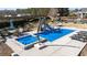 Backyard pool area featuring a hot tub, slide, and lounge chairs at 29 Alban Row, Fuquay Varina, NC 27526