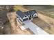 Aerial shot of new home with a long driveway and 3-car garage at 2955 Mt Pleasant Rd, Willow Springs, NC 27592