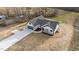 Aerial view of new construction home with 3-car garage and a covered porch at 2955 Mt Pleasant Rd, Willow Springs, NC 27592