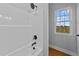Full bathroom with shower and a window for natural light at 2955 Mt Pleasant Rd, Willow Springs, NC 27592