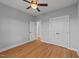 This bedroom has a ceiling fan, wood floors, and a closet for storage at 2955 Mt Pleasant Rd, Willow Springs, NC 27592